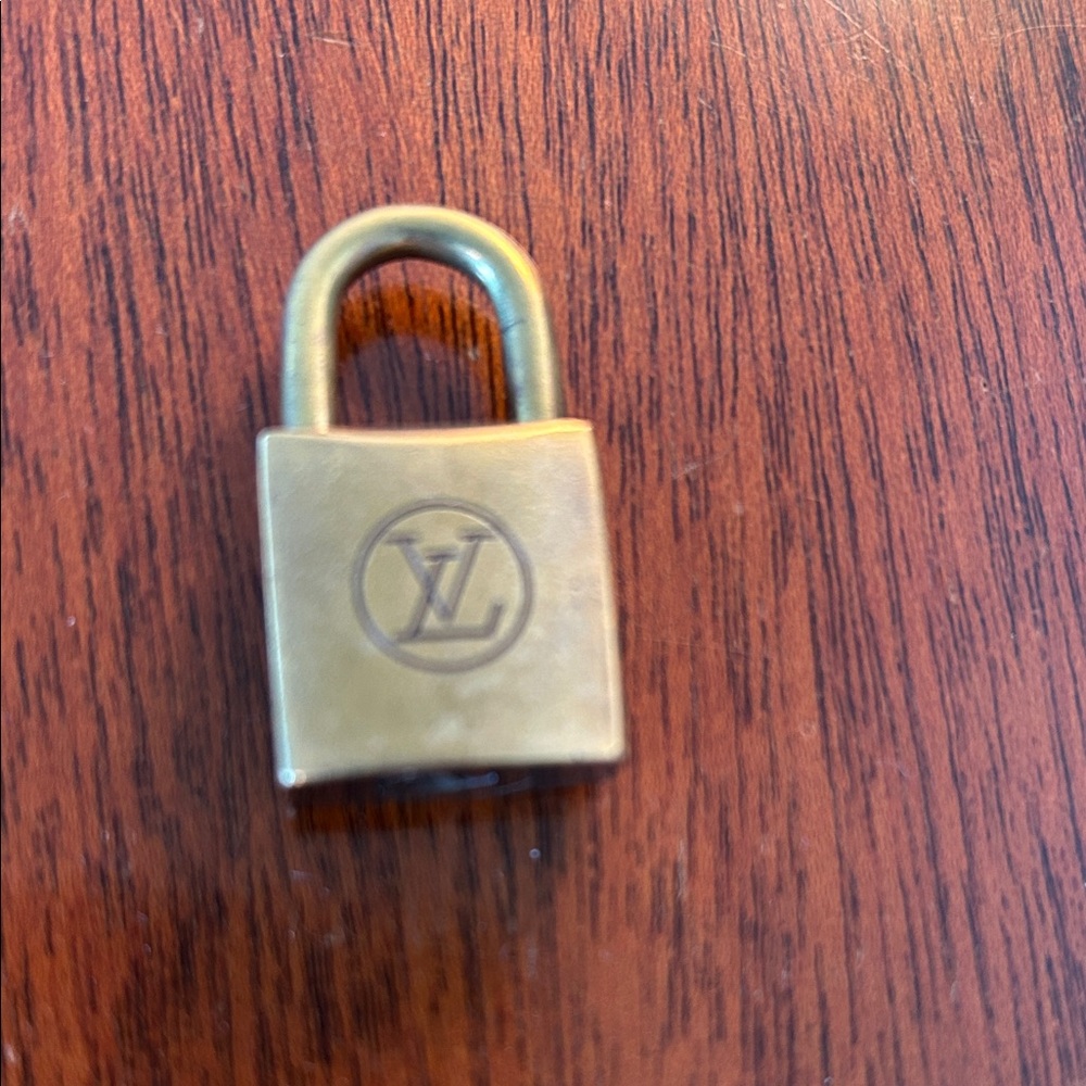 #210 Louis Vuitton Brass Padlock